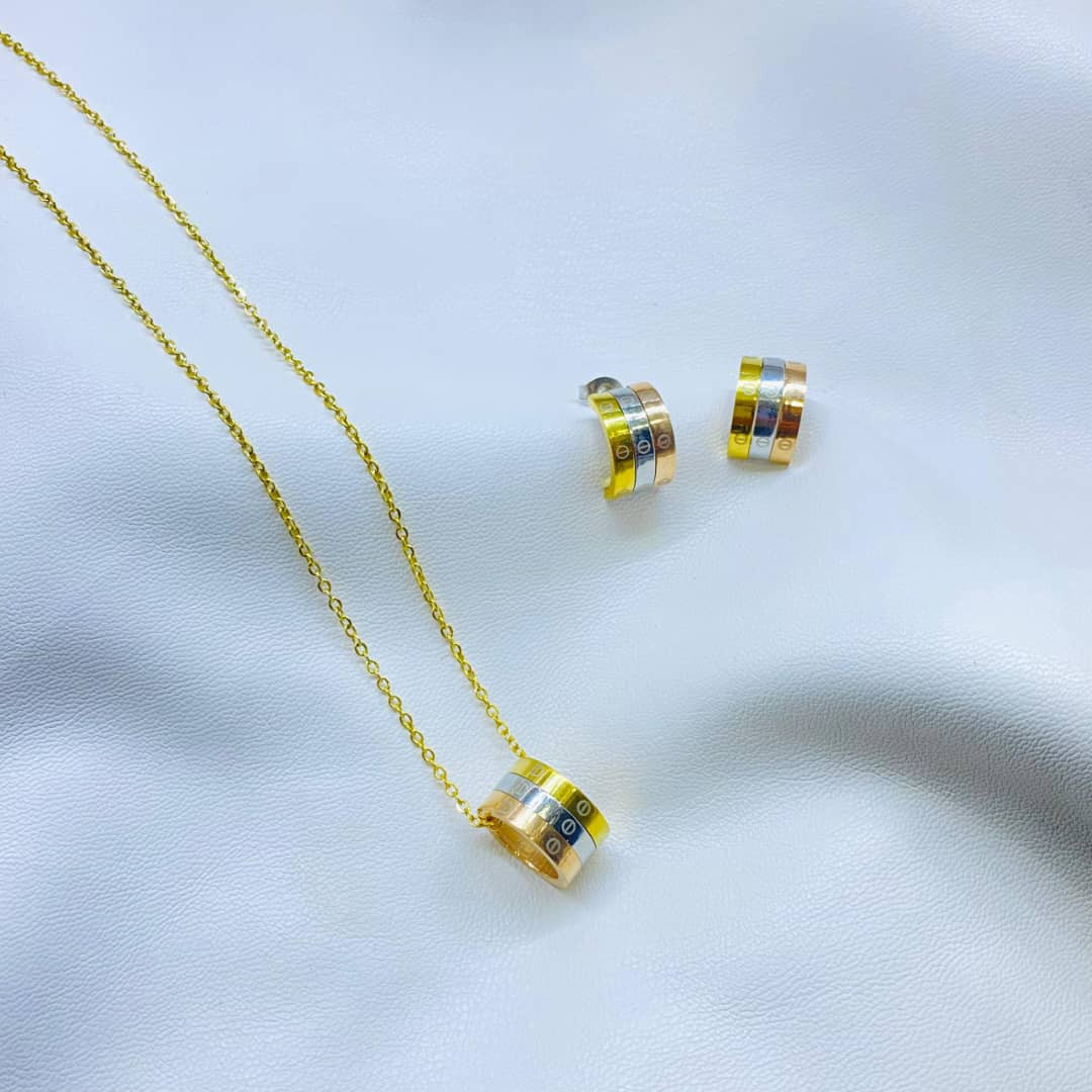 طقم كارتير لوقو ذهبي ناعم  ستانليس استيل  - قطعتين